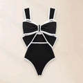 Women's black and white one-piece swimsuit with round skirt and bow detail