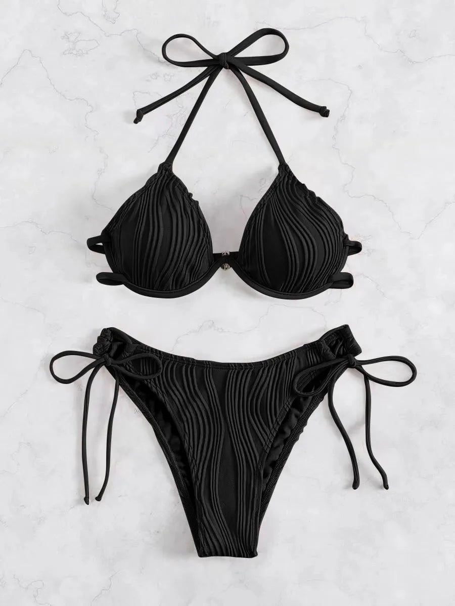 Women's black bikini swimsuit with steel bracket underwire on a mannequin.