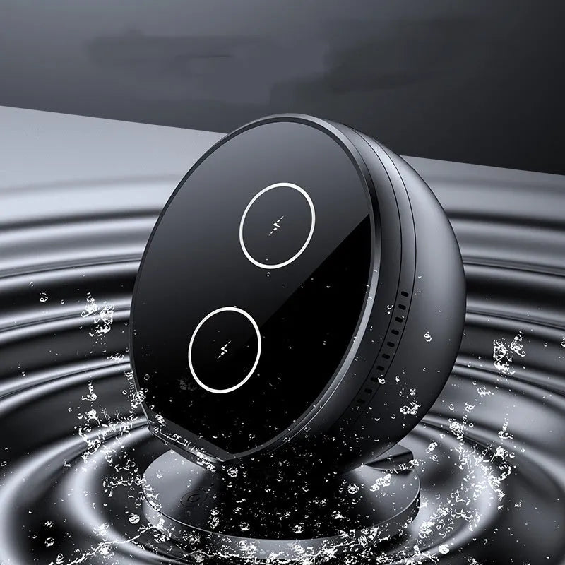 Black multifunctional wireless charging phone holder with built-in Bluetooth speaker on a desk.