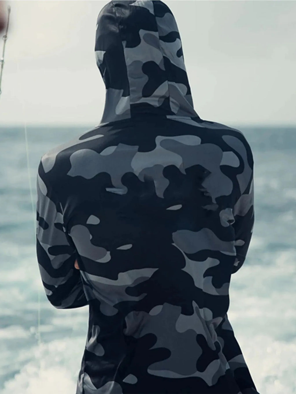 Men's grey long sleeve fishing hoodie with mesh side panels and a face mask, labelled with UPF 50 sun protection.