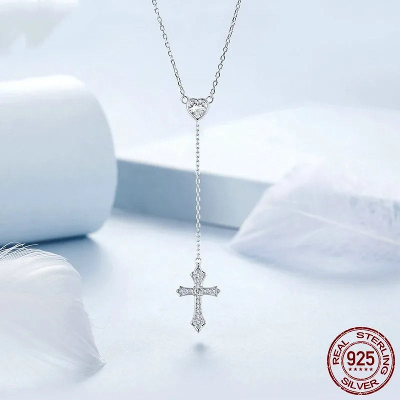 Women's silver love cross necklace with V-neck pendant on O-ring chain.