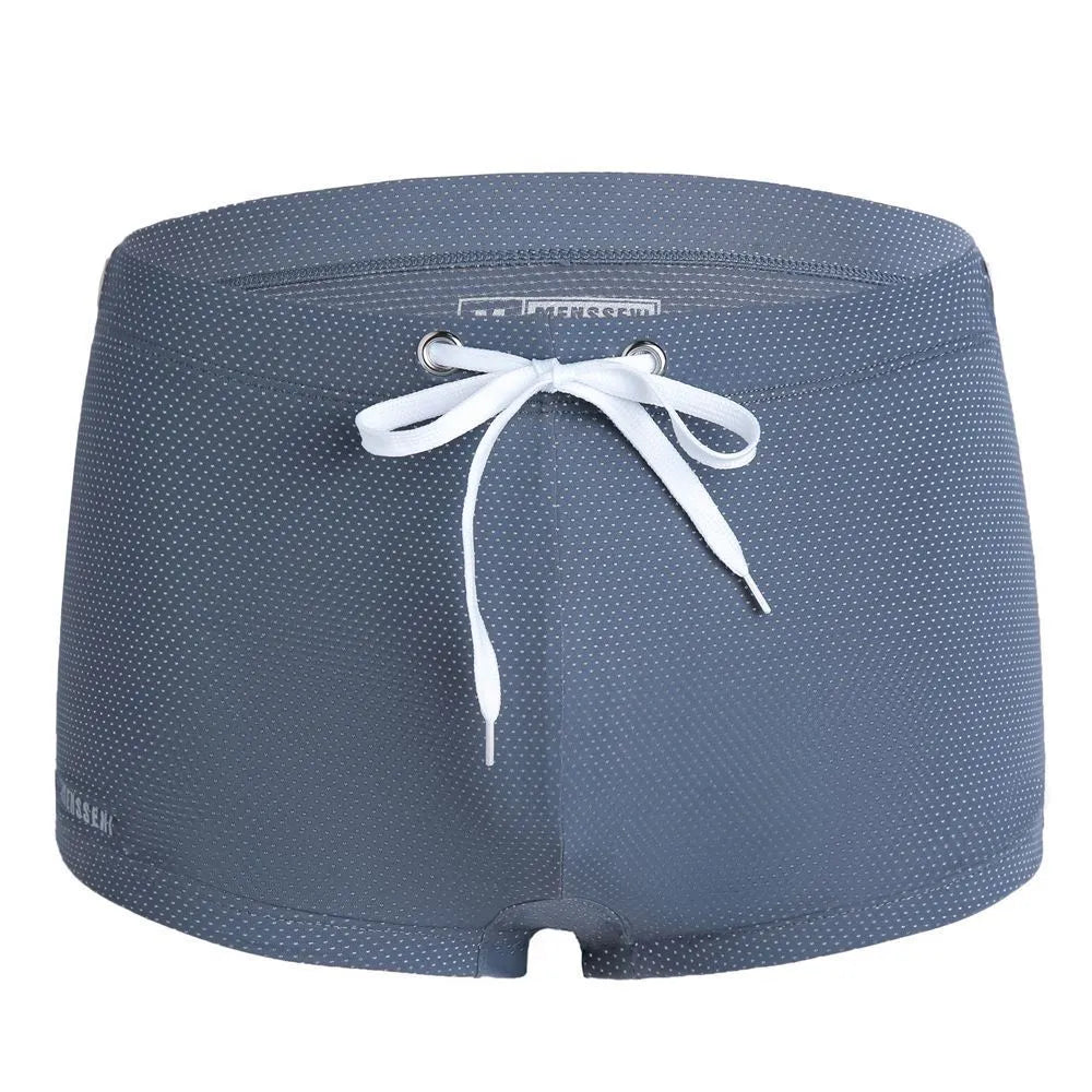 Men's solid colour nylon lace low waist swimming trunks in boxer briefs style.