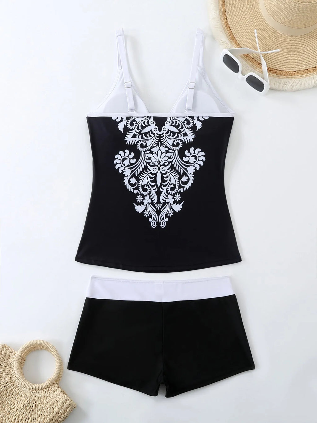 Women's plus size black and rose red two-piece swimsuit bikini set on a mannequin.
