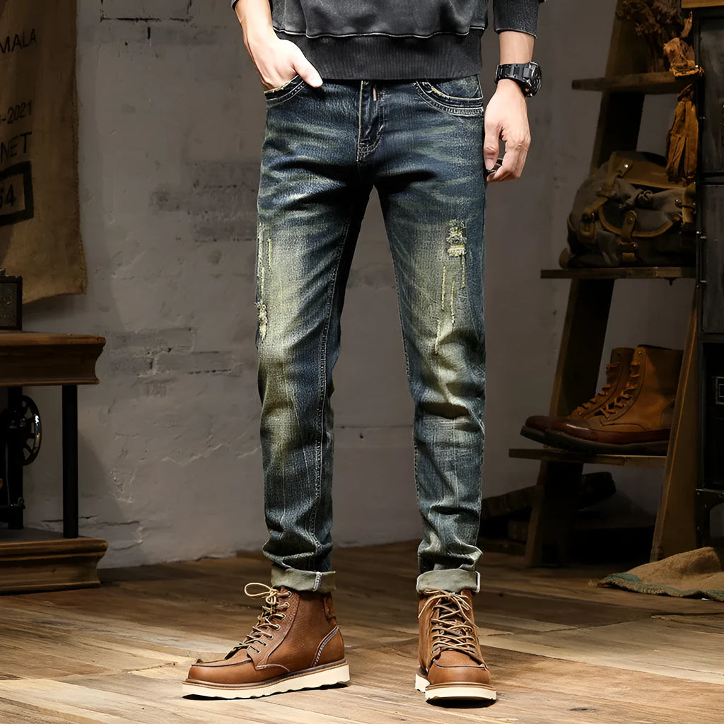 Men's skinny fit stretch denim jeans in a retro blue wash with a five-pocket design.