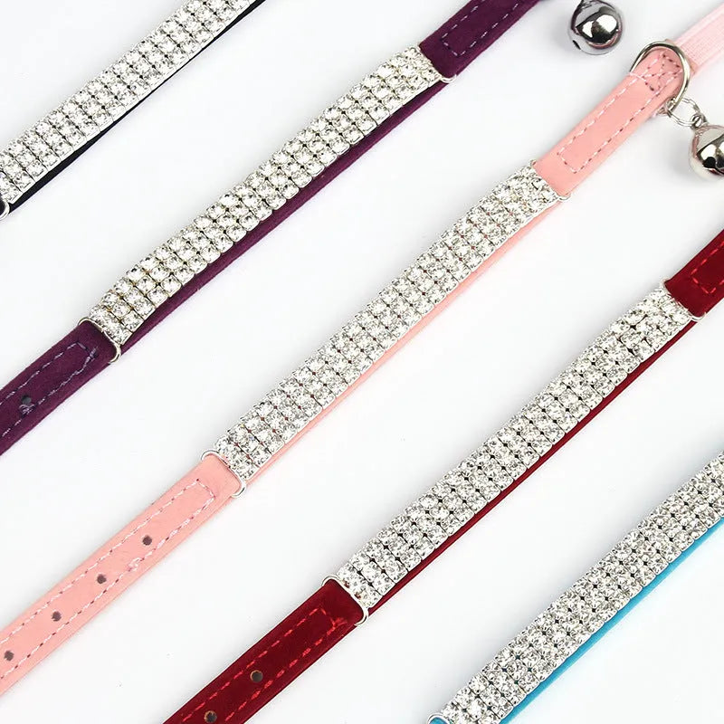 Velvet cat collar with rhinestones in red, blue, purple, black, or pink colours on adjustable strap.