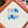Set of hand-painted blue plastic fake nails with carved Summer Ice design in four sizes XS S M L