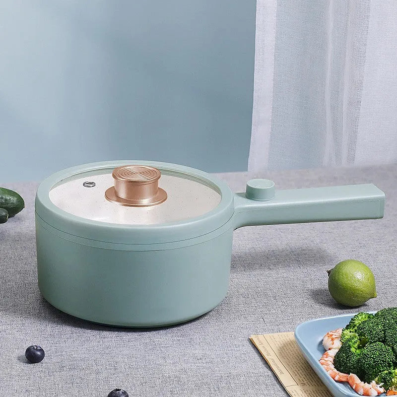 White mini electric cooking pot with 600W power and multiple cooking functions including boiling, steaming and frying
