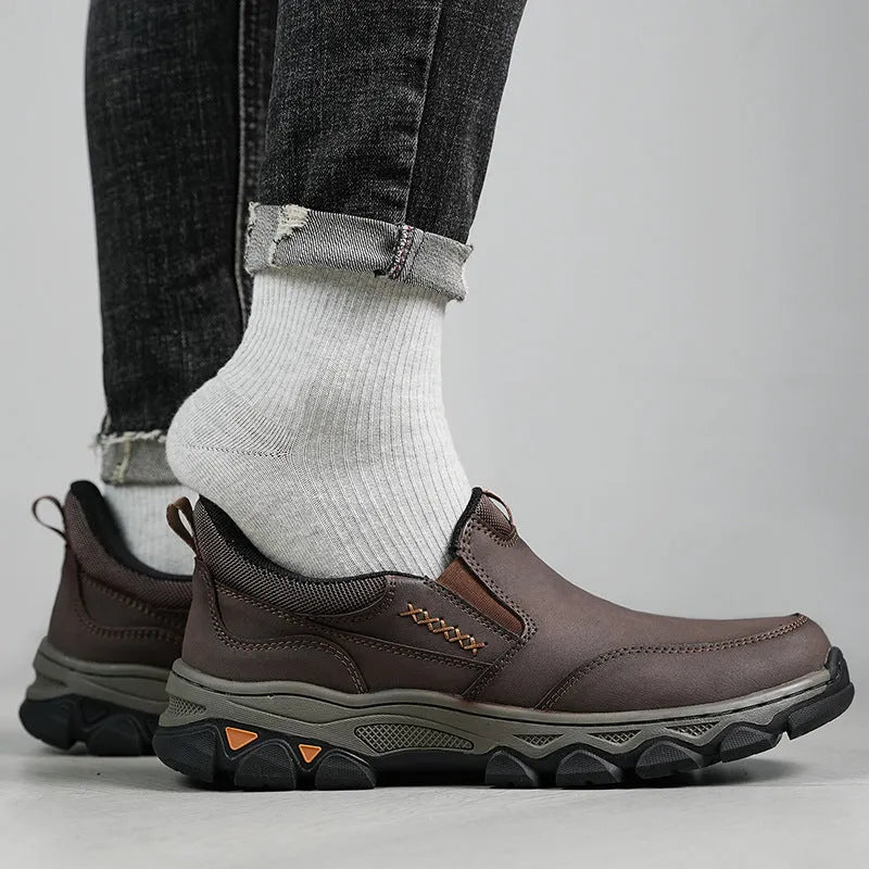 Men's dark brown casual leather shoes with a flat heel and round toe on a white background