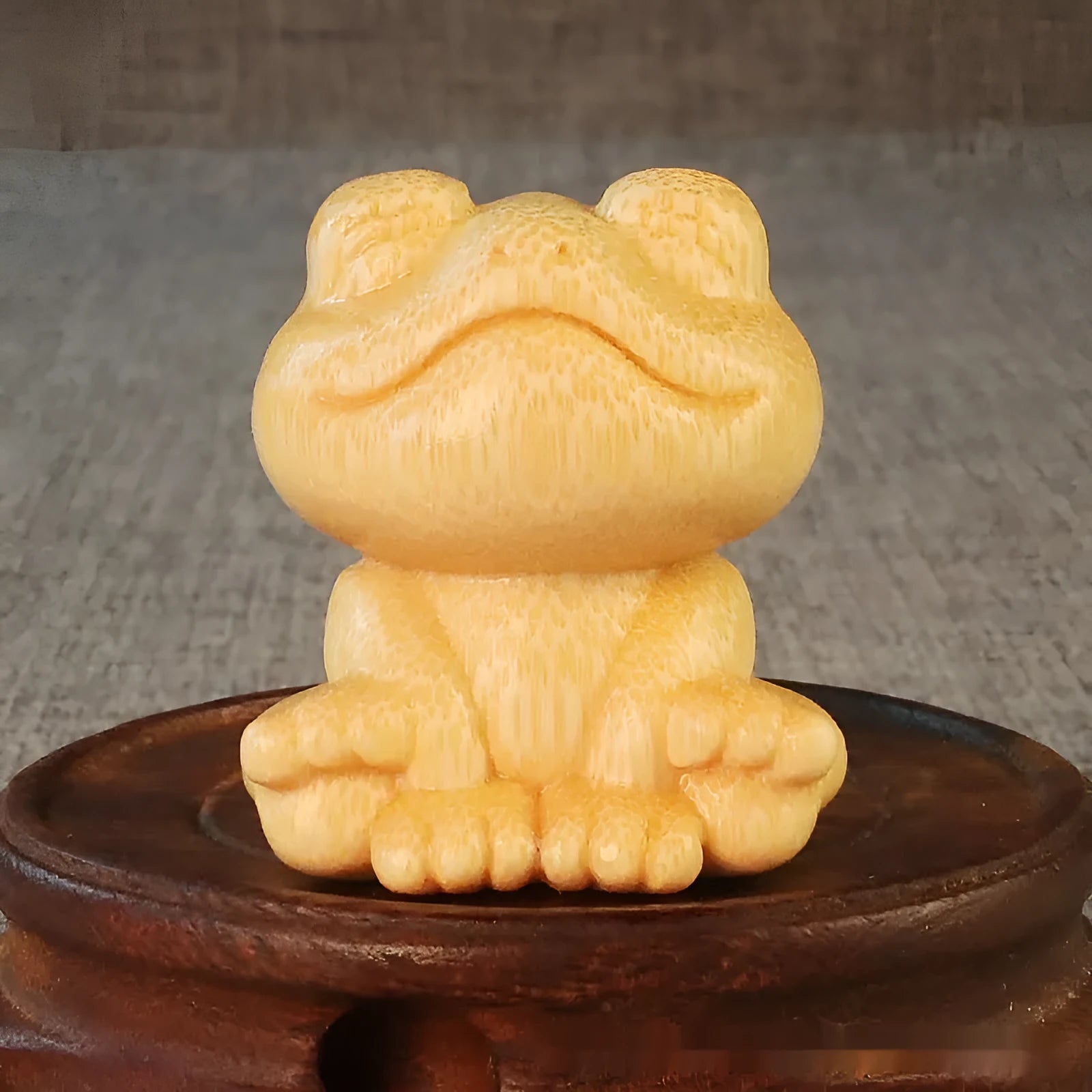 Solid bamboo smiling frog carving ornament measuring 5cm high with cartoon cute style