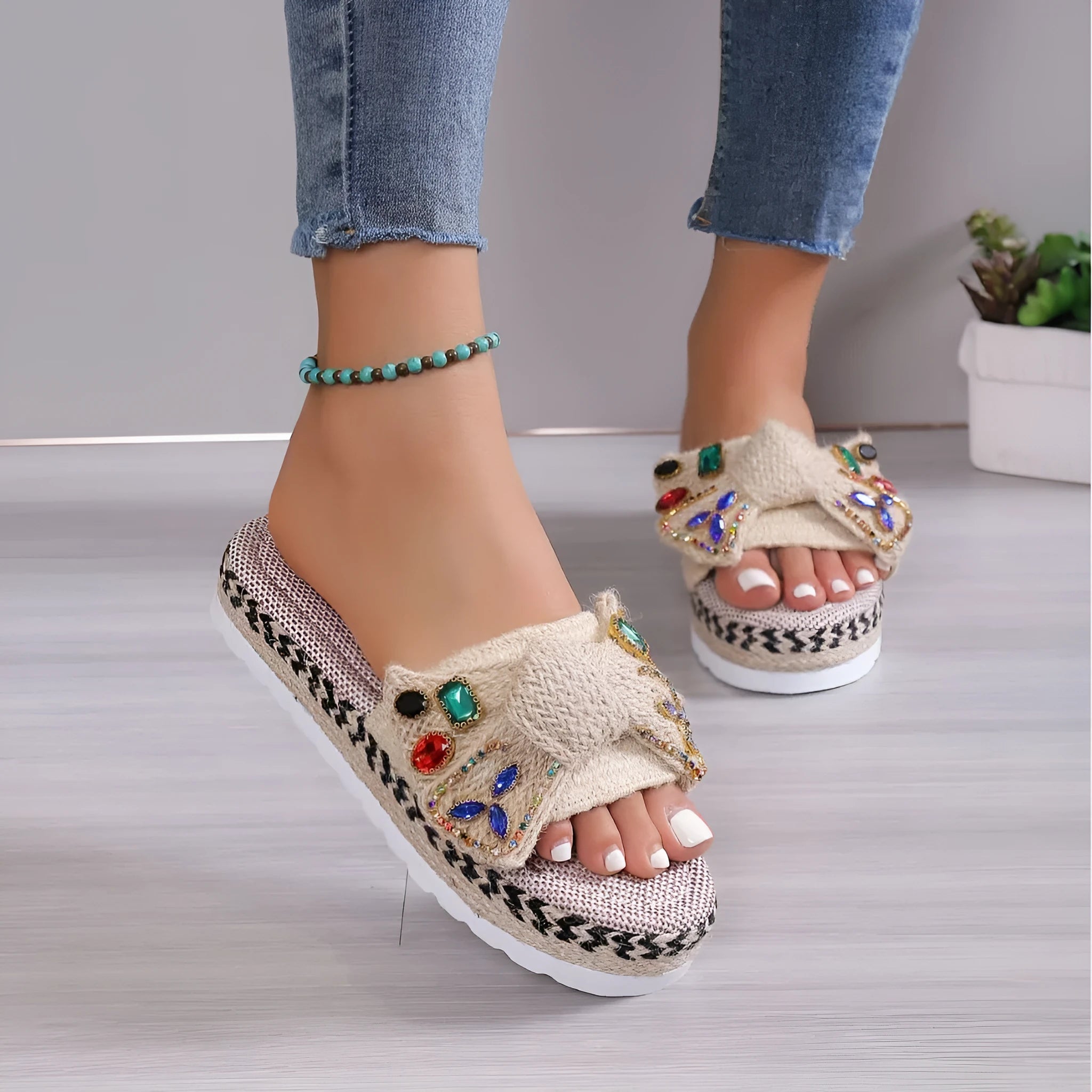 Creamy-white women's platform sandals with a cloth upper, round toe, and a decorative beach bow.
