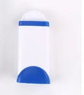 Blue reusable pet hair removal brush with self-cleaning base on a grey sofa.