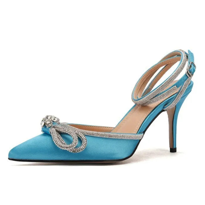 Women's black stiletto heel sandals with a silk back bandage and pointed toe on a white background.