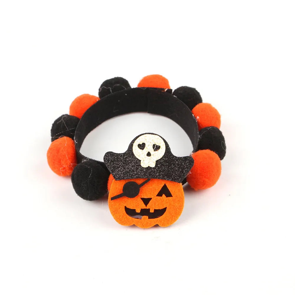 Halloween pet collar with fur ball decoration in pumpkin design on dog neck
