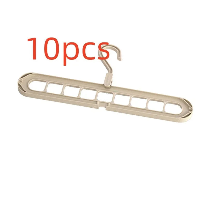 Green nine-hole plastic folding hanger for trousers and skirts showing multiple garment hanging points