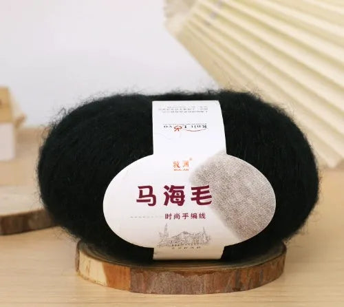 Ball of mohair yarn for DIY scarf knitting in one of 34 colours, including white, pink, blue, and green.
