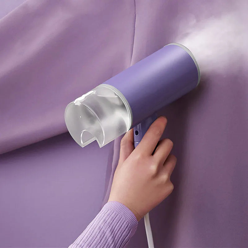 Portable handheld garment steamer in foldable design with purple colour option