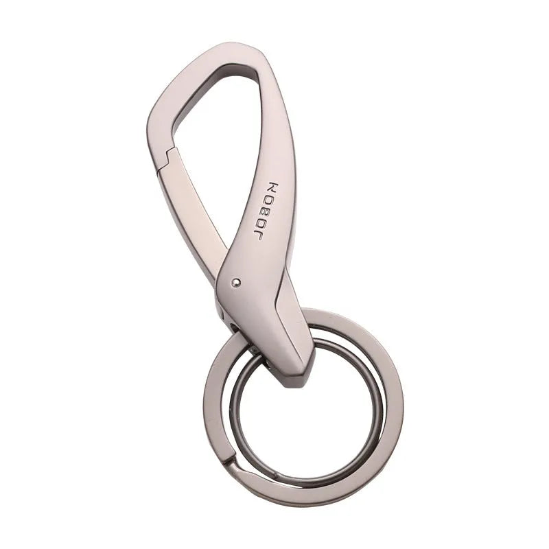 Black zinc alloy keychain with two split rings and a waist clip, shown next to a car key for scale.