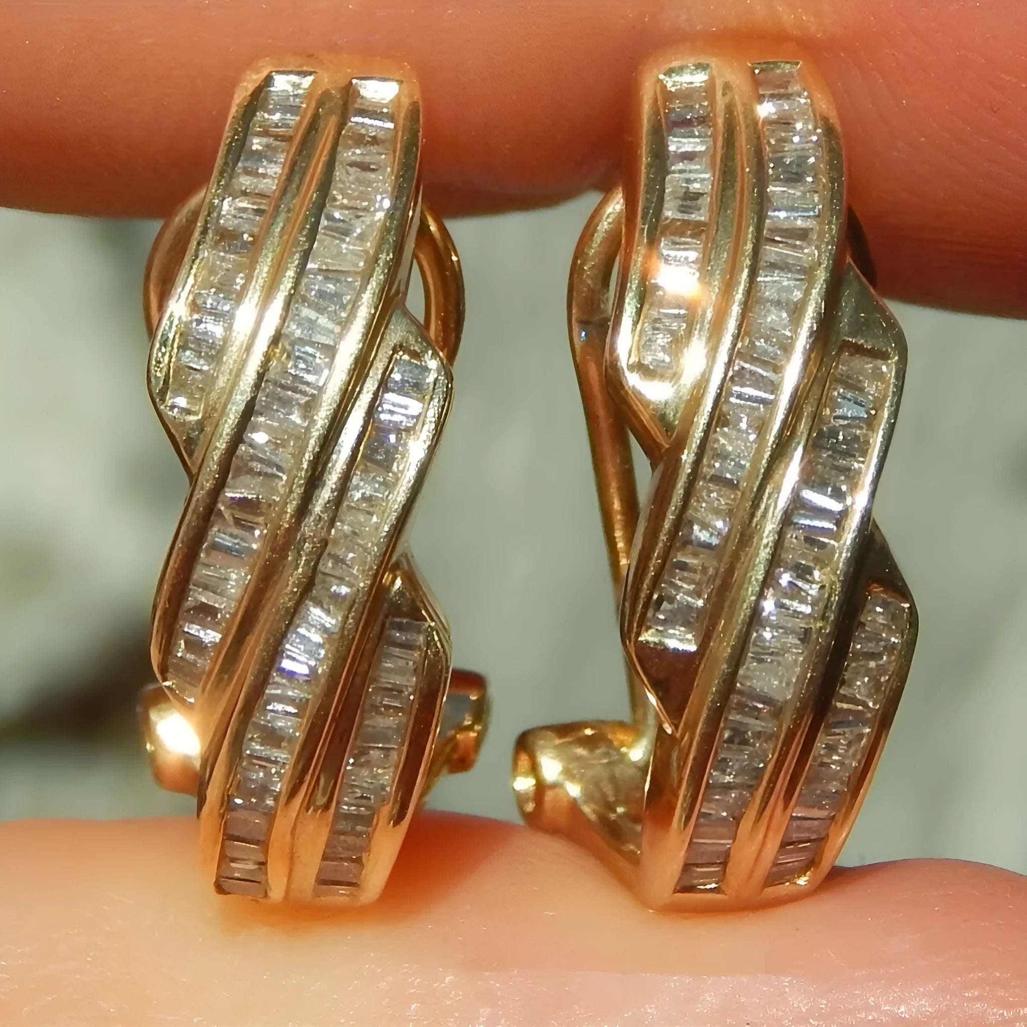 Gold geometric earrings with circular design elements on copper construction