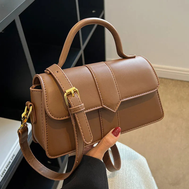Women's PU leather messenger bag in neutral colour with file organiser interior and sandwich pocket