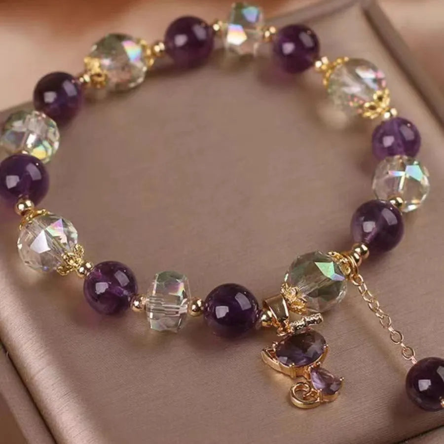 Women's antique-style crystal bracelet with a nine-tailed fox pendant and a separate amethyst floral charm.