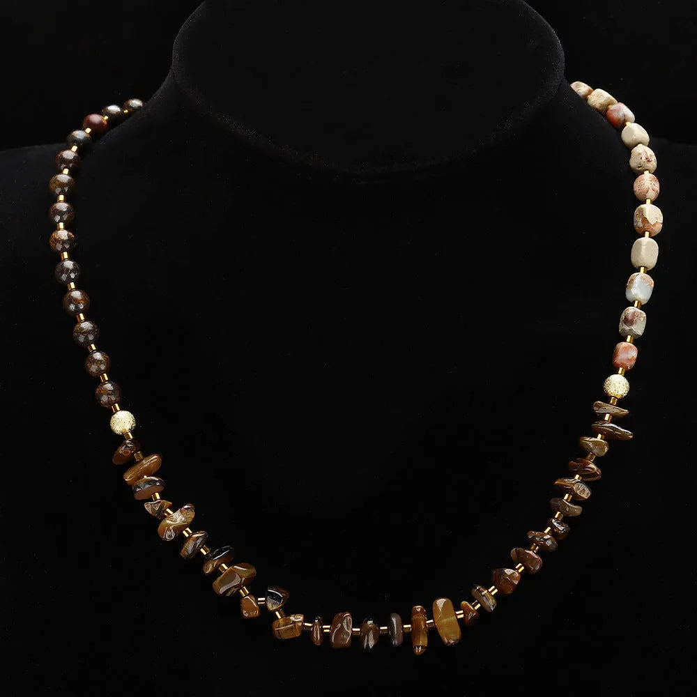 Tigereye stone and bronze geometric bracelet with glow ball design and texture details