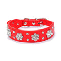 Black PU leather dog collar with rhinestone flower pattern and studs, adjustable for small dogs.