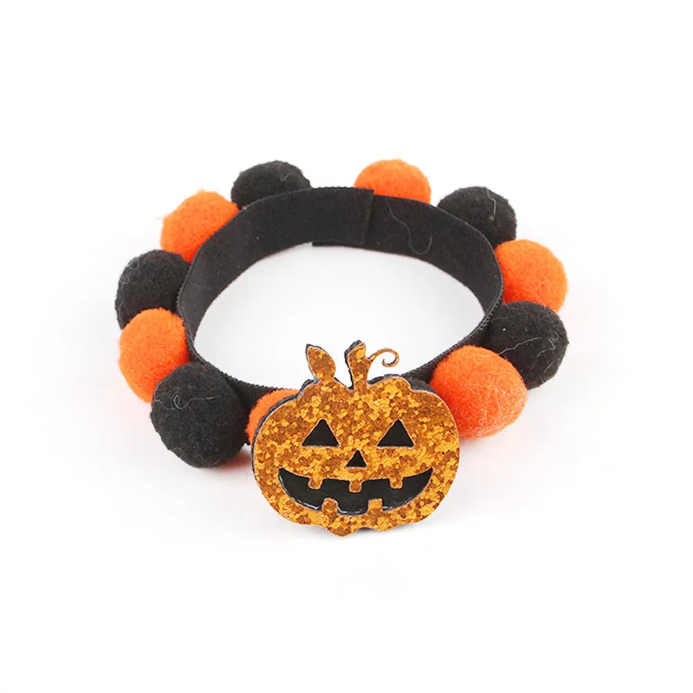 Halloween pet collar with fur ball decoration in pumpkin design on dog neck