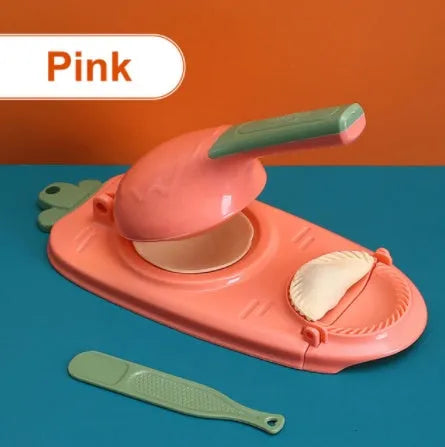 Orange and white manual dumpling skin press tool with ergonomic handle and hanging hole
