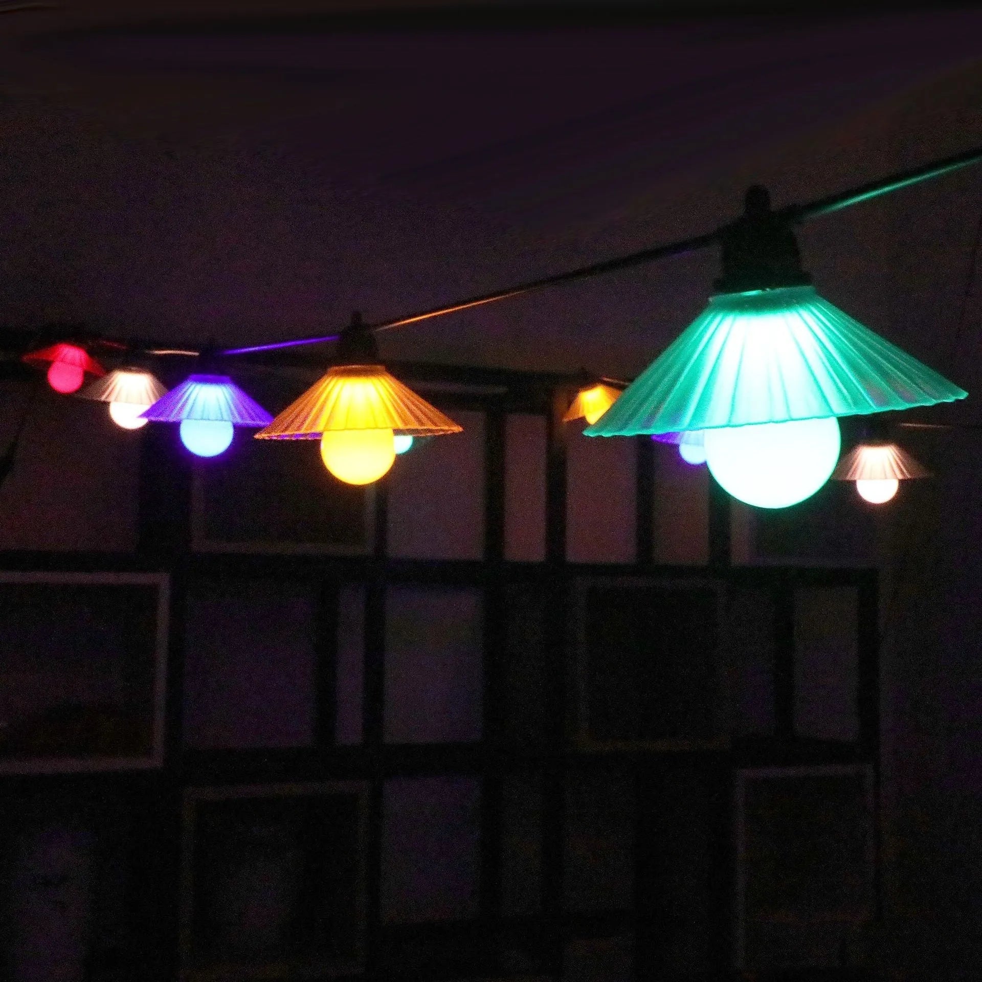 Outdoor LED string lights with flower-shaped bulbs in warm white and multi-colour options.