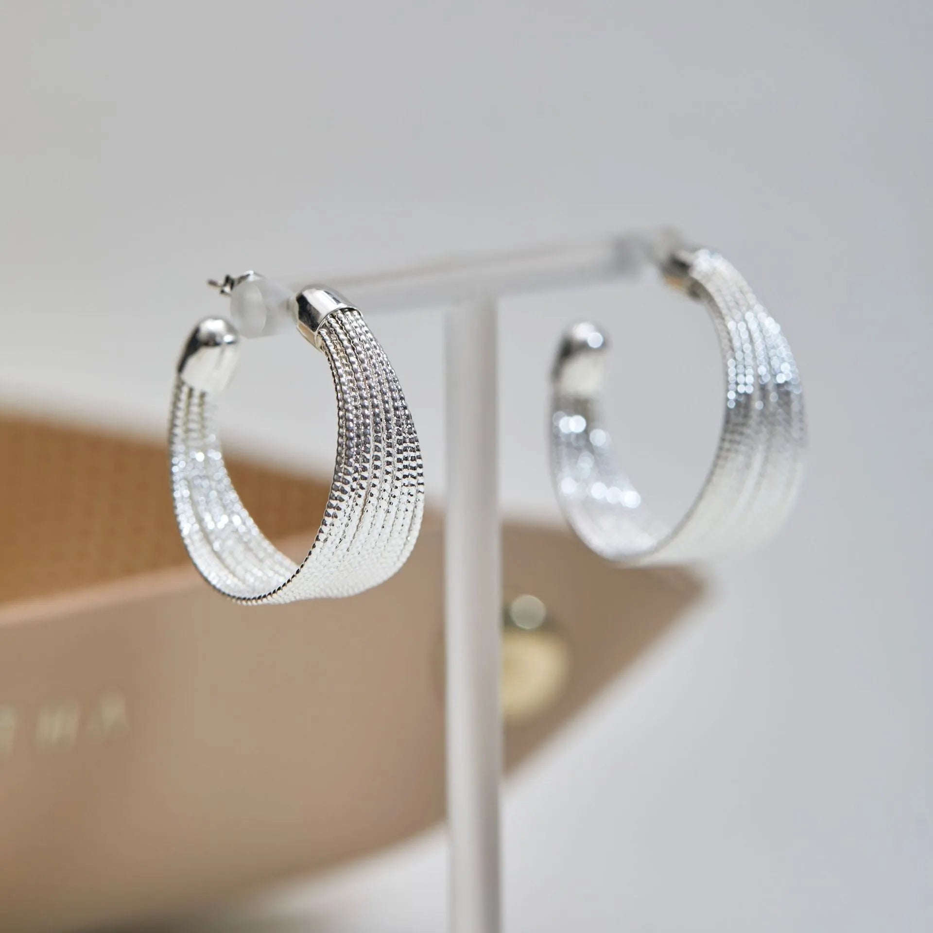 Copper geometric multi-layer bracelet earrings with electroplated silver and gold finish showing stud and clip pieces