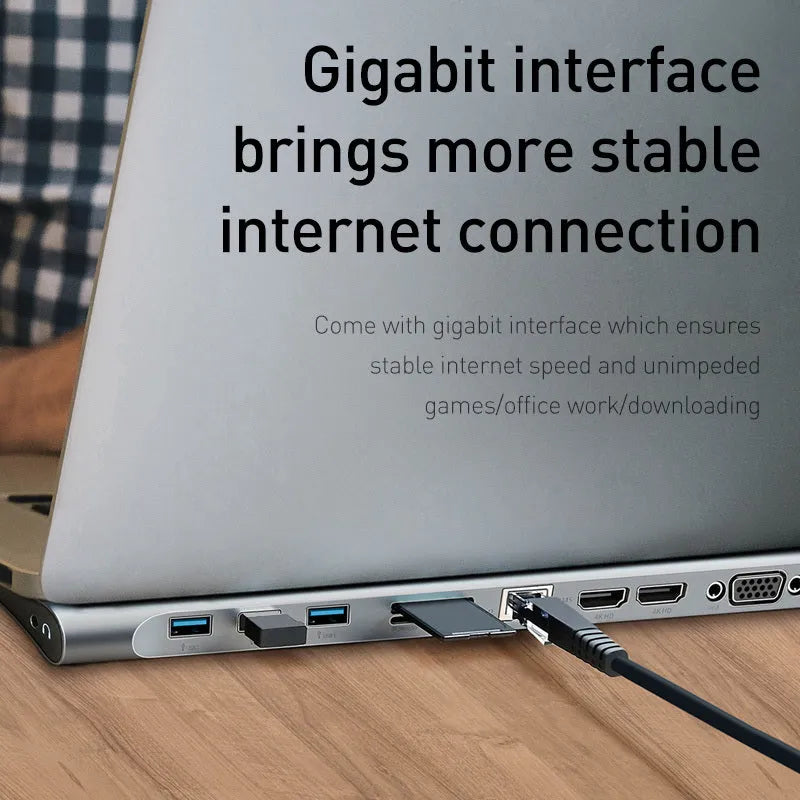Grey aluminium ten-port laptop docking station with cooling bracket showing HDMI, VGA and USB connections