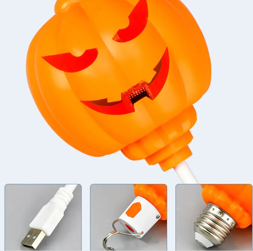 Plastic pumpkin-shaped decorative lamp with USB cable, showing yellow or purple LED light option.