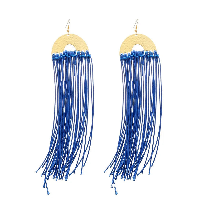 Women's geometric earrings with blue resin flower on textile base, circular shape
