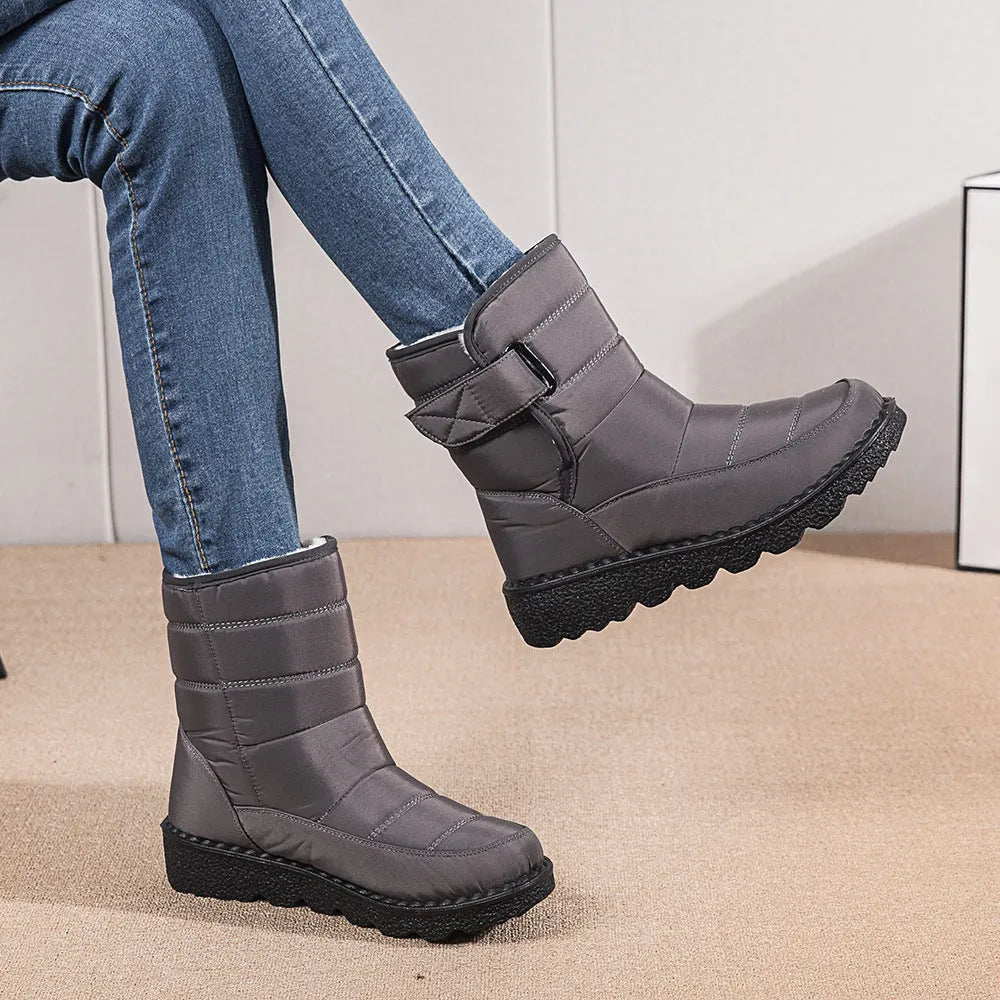 Women's waterproof snow boots with canvas upper, PU sole, buckle closure, and belt decoration