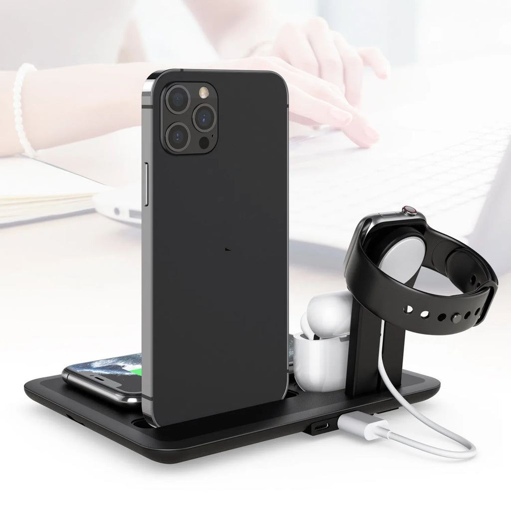 Black desktop wireless charging stand with a phone on its Qi pad and cables connected to its USB ports.