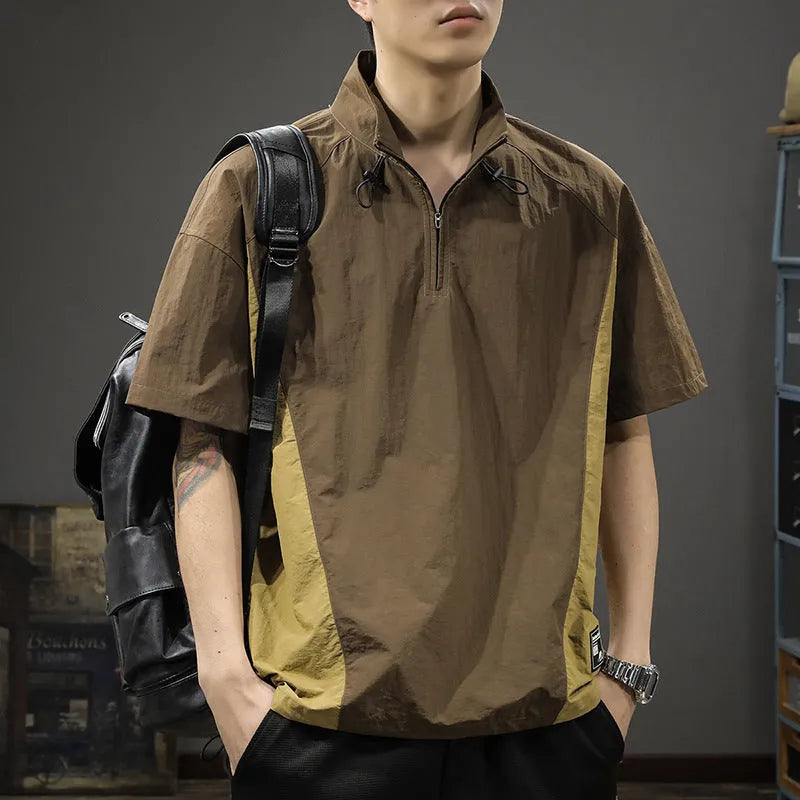 Brown men's half-zip stand collar casual shirt with short sleeves on a hanger.
