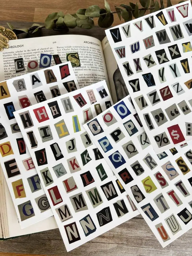 A4 sheet of colourful English alphabet, number, and word stickers in a cute style for decoration and organisation.