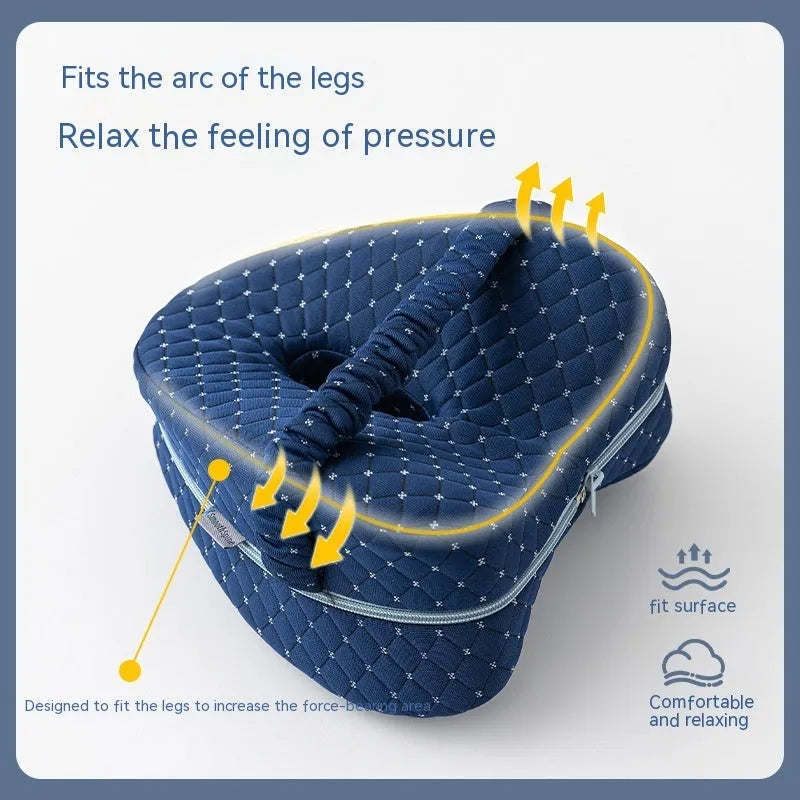 Heart-shaped dark blue memory foam leg pillow for adult use.