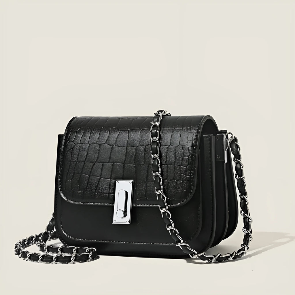 Soft black PU leather women's chain shoulder bag with adjustable strap and square shape.