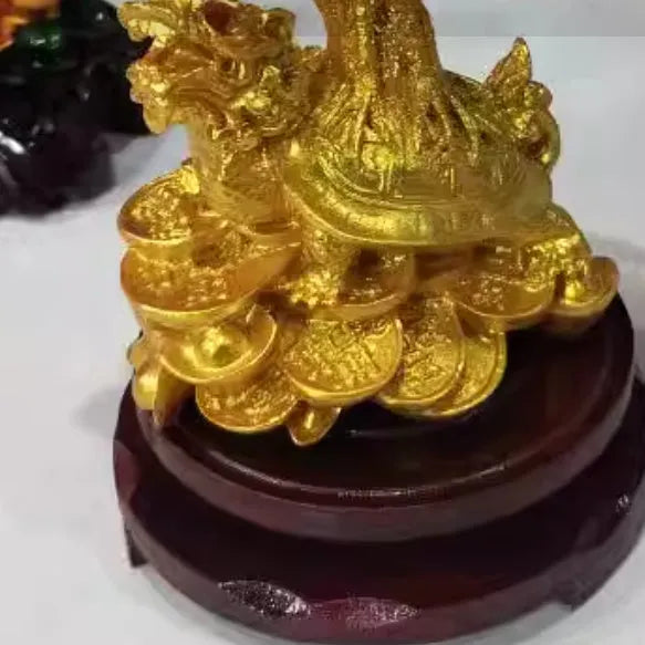 Citrine coloured resin money tree ornament with small water turtle model in Chinese style.