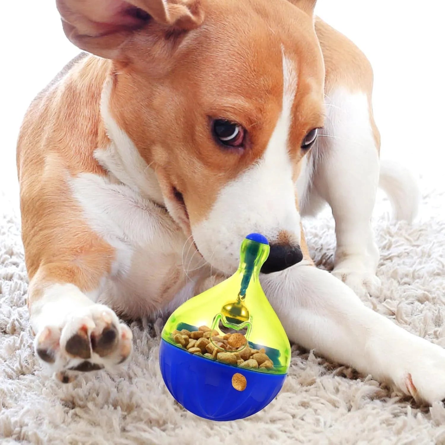 Blue and white tumbler-shaped pet treat dispenser toy on a wooden floor.