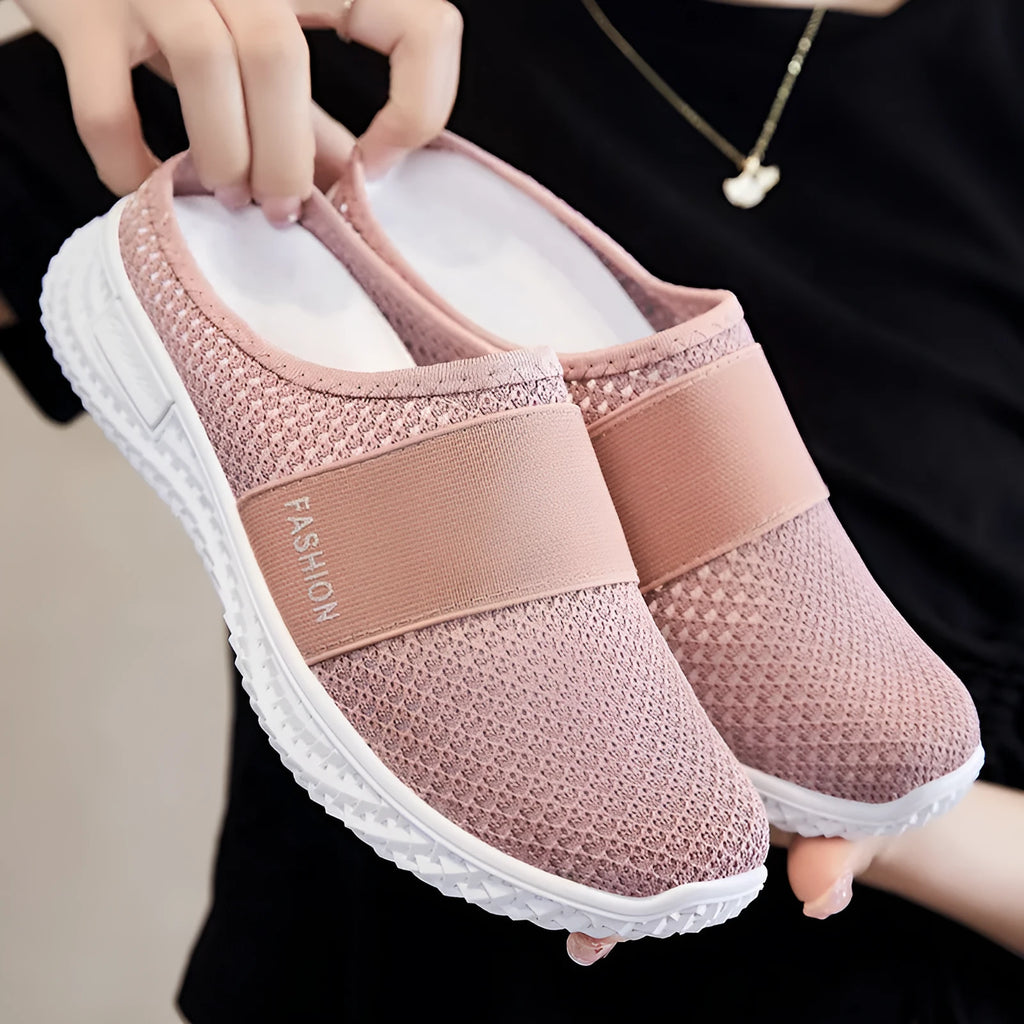 Women's breathable mesh casual shoes with flat heel and hollow-out design in black, grey, pink, or purple.