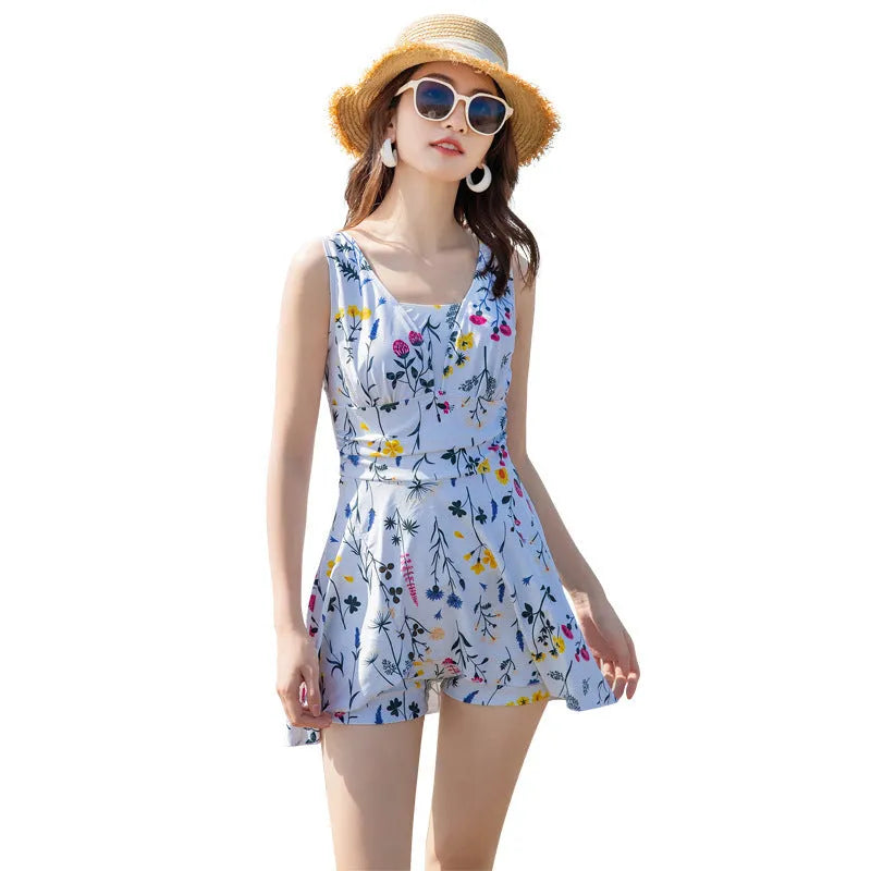 Light purple women's one-piece swimsuit with floral print on a mannequin