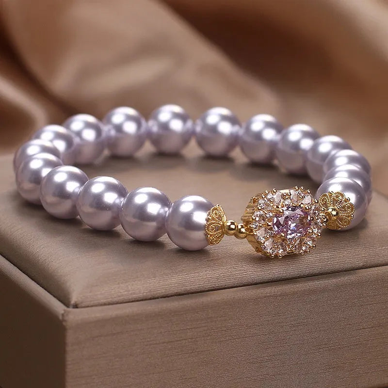 Dreamy purple zircon pearl bracelet with diamond flower charm on wrist