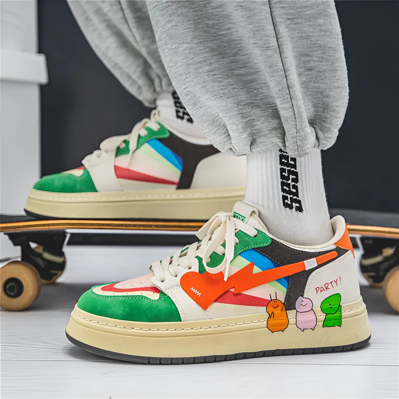 Pair of plain style lace-up casual sneakers on a white background, shown in Rainbow colour.
