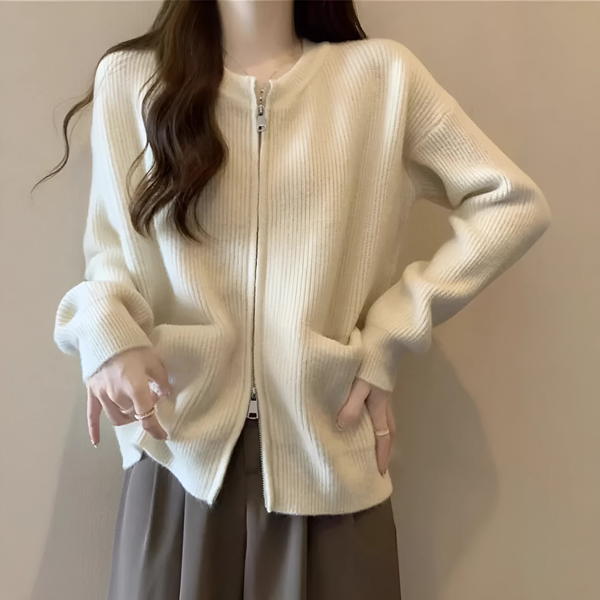 Beige women's cardigan-style sweater coat with long sleeves made from soft viscose.