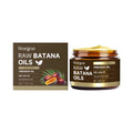 Batana oil hair cream in a white tub with green label, 114g size