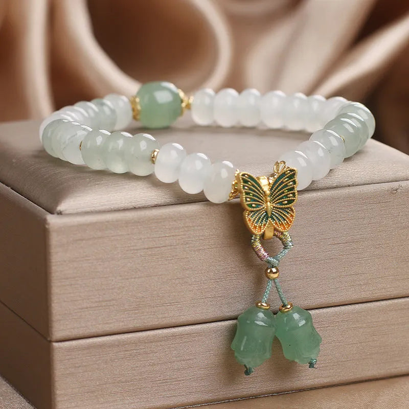 Green Tian Shan Cui abacus bead bracelet with crystal construction and butterfly tassel charms