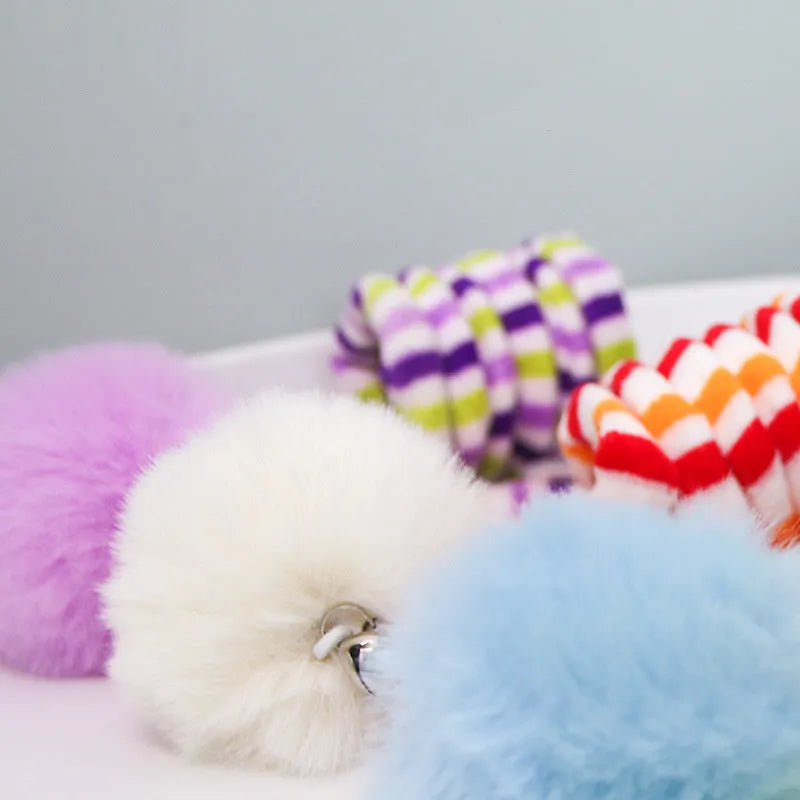 Spring cat toy with bell stick, inflatable ball, and suction cup mount in multiple colour options