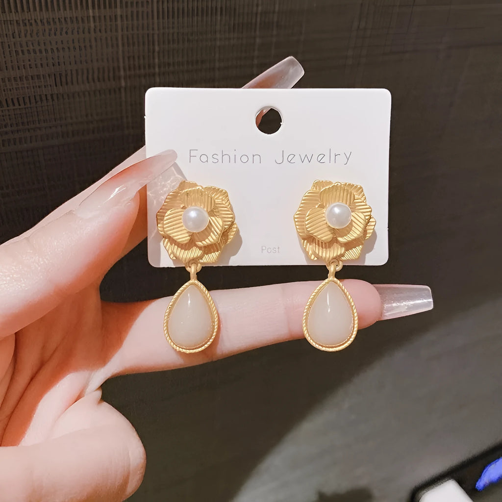Gold electroplated floral stud earrings with opal stone and sterling silver posts in Hong Kong style design
